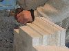 Stonemason (taileur de pierre) at work on a window frame