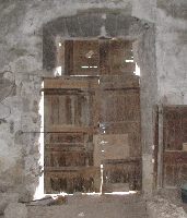 Before: Old window in the Great Hall of the Château de St-Ferriol, converted into a door, probably arounf 1900